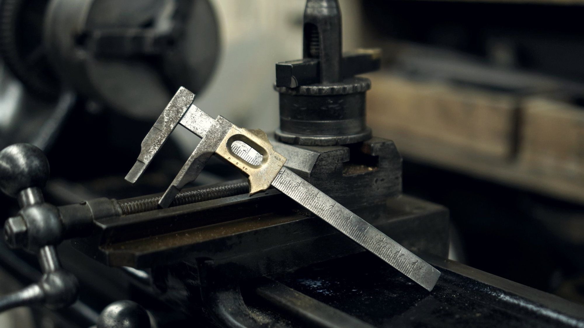 Lathe tool post with a gauge set against the workpiece